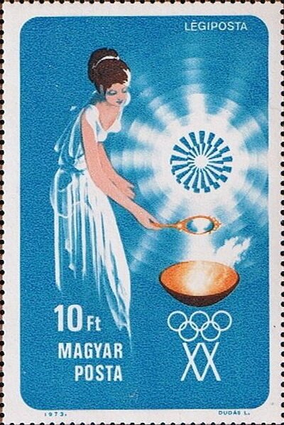 Woman lighting Olympic Flame