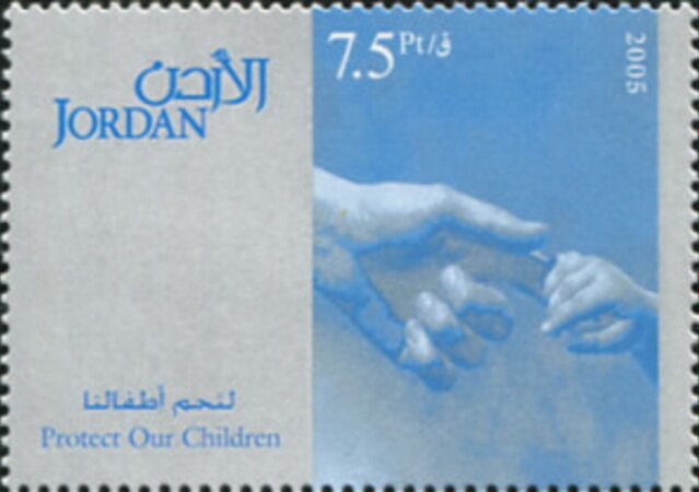 Child grasps a man's finger