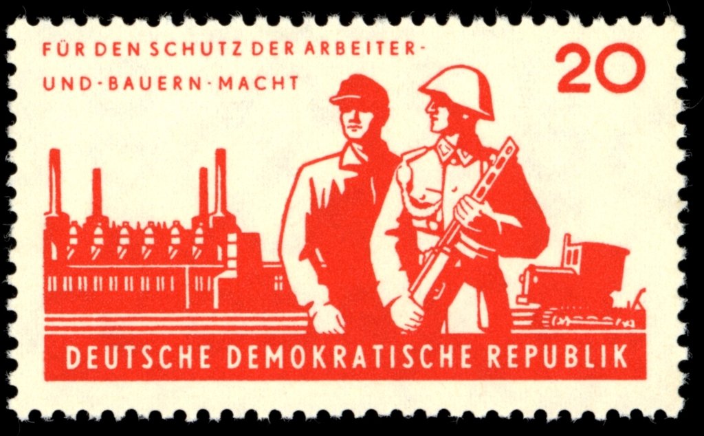 Soldier and worker, industrial plant, tractor
