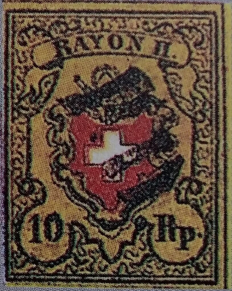 Coat of arms below post horn with cross edging