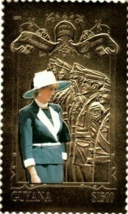 Diana wearing suit and hat inspecting troops