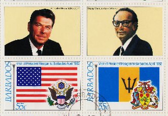 Pair, Barbados' and US' flags and arms