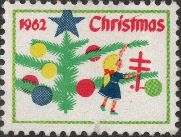 Young girl decorating Christmas tree