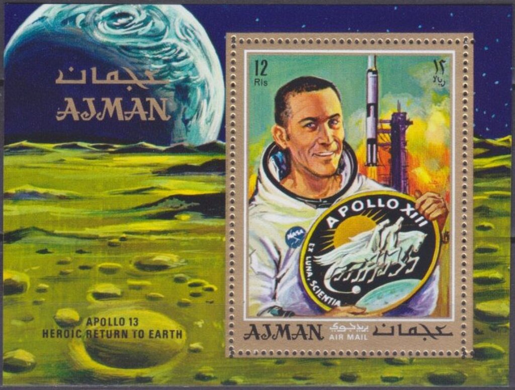 Swigert with Apollo 13 Emblem