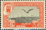 Falcon flying over bridge