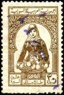 Woman holding basket of fruit