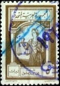 Allegory of Justice with scales and book