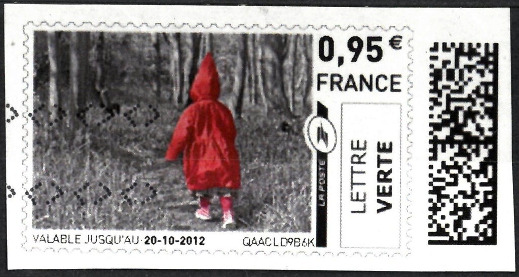 Child in Red Raincoat. Little Red Riding Hood in the woods