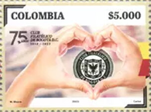 Hand Forming Heart Around Club Logo
