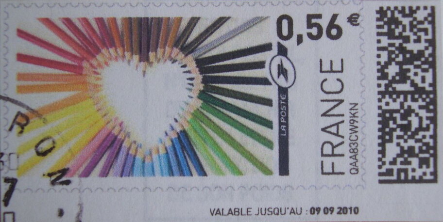 Heart design made from coloured pencils