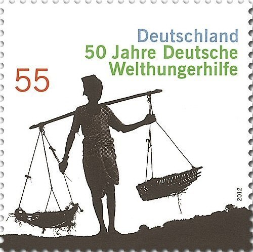 Woman carrying Baskets on Yoke