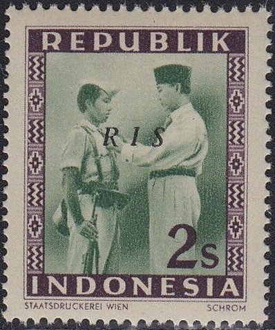 President Soekarno Decorates a Soldier