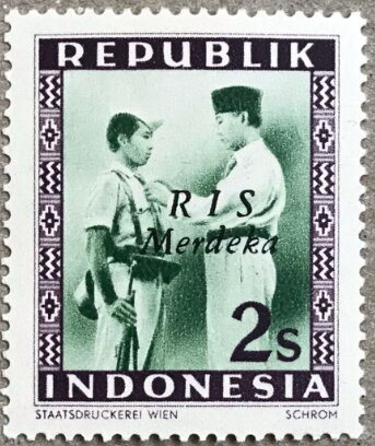 President Soekarno Decorates a Soldier