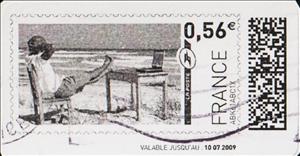 Stamp, Man with his feet up on the beach watching his laptop, France,  , Beaches