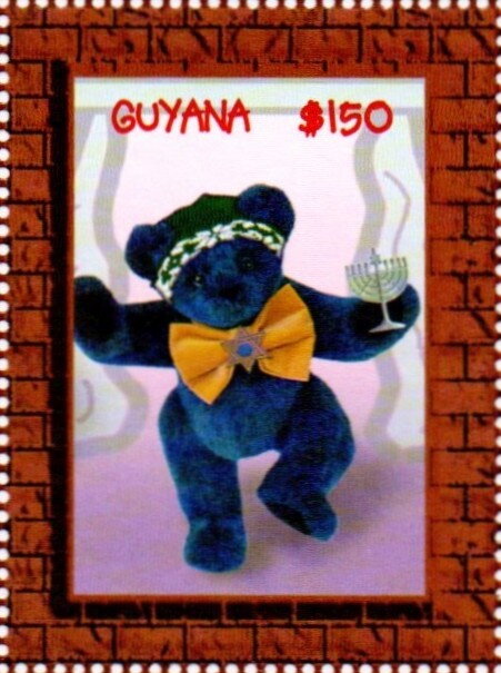 Blue bear dressed in yellow bow tie