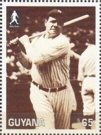 At base with bat on shoulder (in striped shirt)