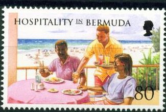 Waiter serving couple