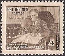 Franklin D. Roosevelt with stamp collection