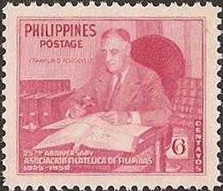 Franklin D. Roosevelt with stamp collection