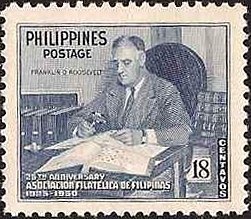 Franklin D. Roosevelt with stamp collection