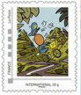 Gouzou delivering mail on a bike in the forest