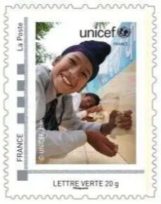 Unicef Boy in a black head scarf