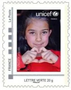 Unicef Girl giving a love gesture