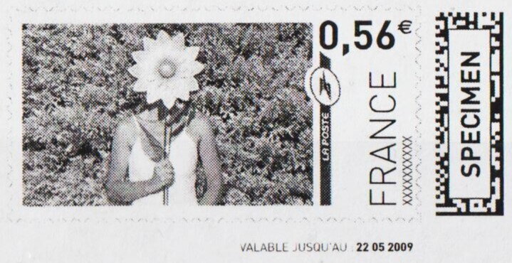 Women holding a sort of sunflower on a stick