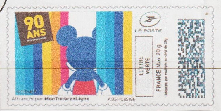 Mickey from behiind in a rainbow coloured curtain
