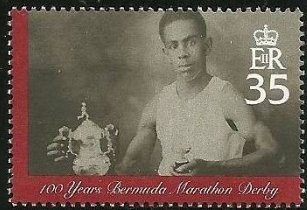 Athlete with trophy and cup