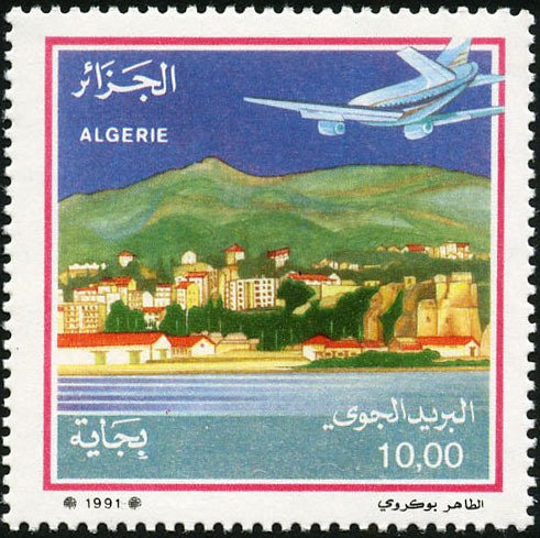 Plane approaching coastal city