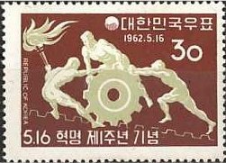 Men Pushing Cogwheel