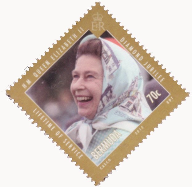 Queen (in a headscarf) laughing, at Windsor Polo Club in 198