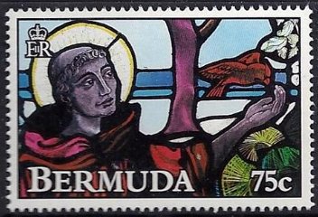 St. Francis feeding bird