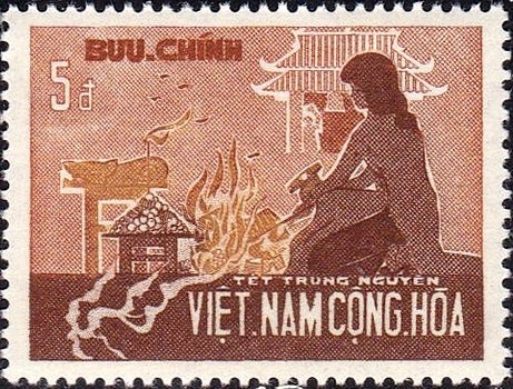 Woman burning paper offerings