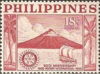 Albay volcano on Luzon, sailing boat & Rotary badge