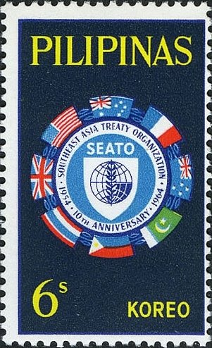 Flags surrounding SEATO emblem