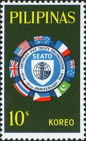 Flags surrounding SEATO emblem
