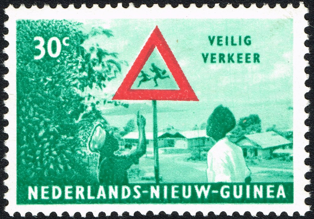 Men looking at traffic sign