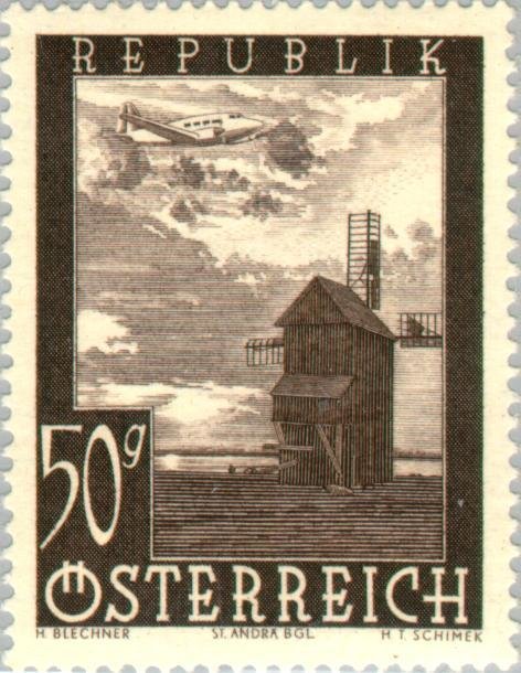 Airplane over windmill in St. Andrä (Burgenland)