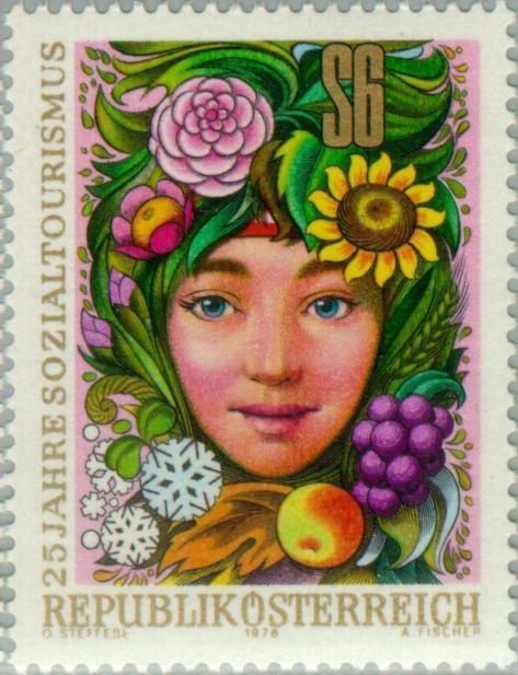 Girls head, surrounded by flowers, fruit, grain, grasses & i