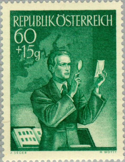 Collector examining a stamp