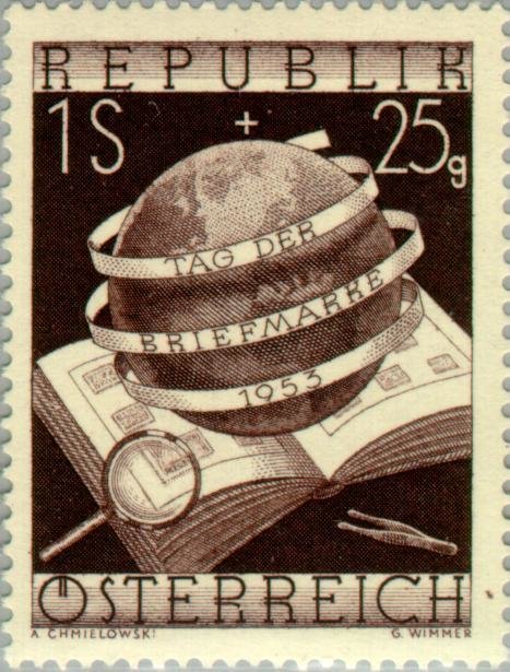 Stamp album, magnifier & globe with inscription