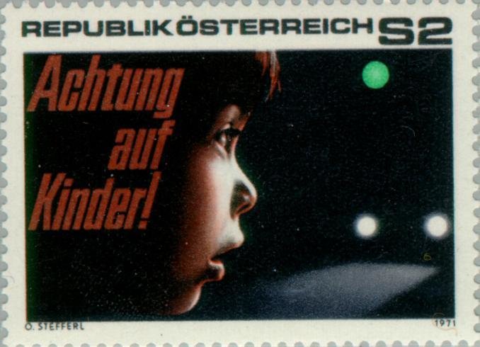 Child, traffic light & car headlights, inscription