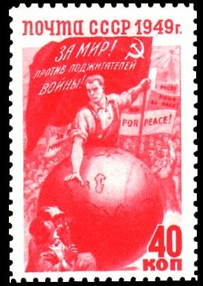 Worker with flag behind globe