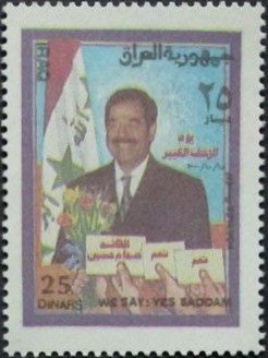 Saddam Hussein, hands with ballot papers
