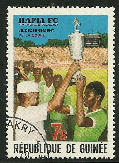 President Toure and Player Holding Cup