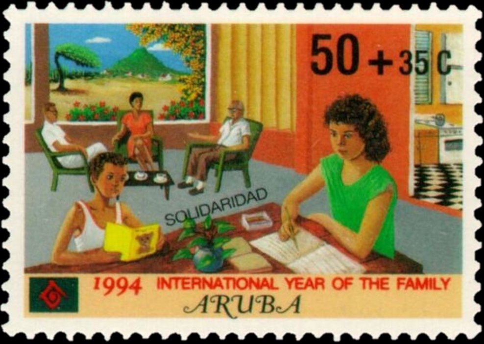 Family seated, reading, studying