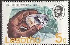 Hand holding Lesotho brown diamond