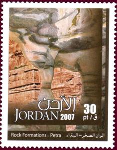 Stamp, Natural water-formed rock columns, and rock face carved with, Jordan,  , Rock
